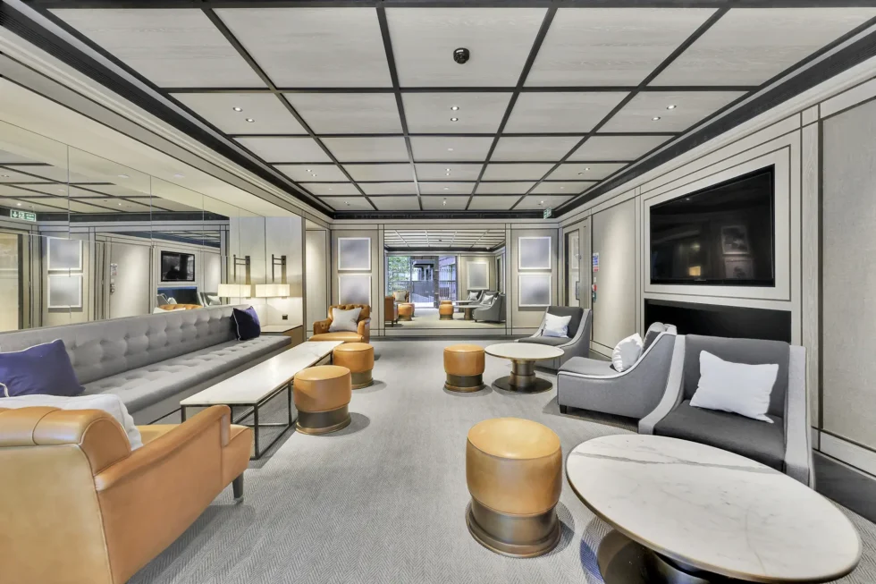 Further seating in the residents' lounge, with a large screen and banquette