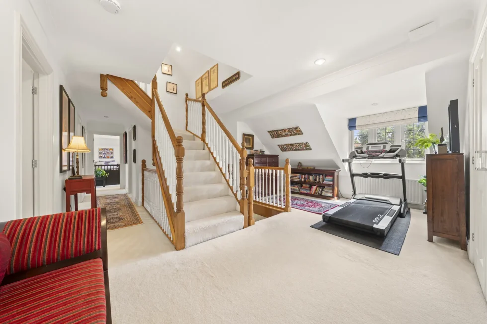 Landing with carpeted staircase rising to the converted loft bedroom
